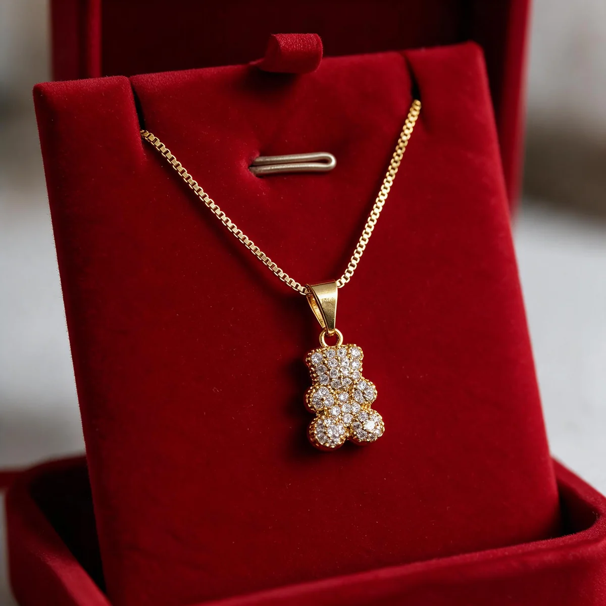 Cadena de oro goldfilled 18K con dije osito de circones en estuche rojo